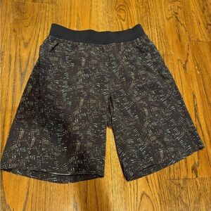 Lululemon size medium unlined pace breaker 9”shorts black with green and yellow